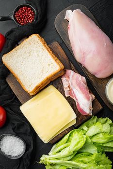 Club sandwich ingredient, on black background, top view
