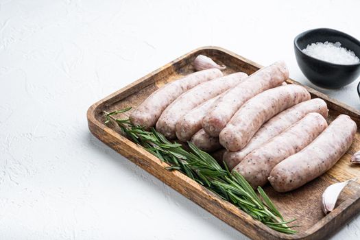 Traditional chicken sausages with space for text, on white background.