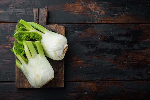 Fresh florence fennel bulb, on old wooden table, top view with space for text