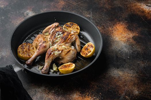 Homemade chicken rotisserie with thyme and lemon, on old rustic background with copy space for text