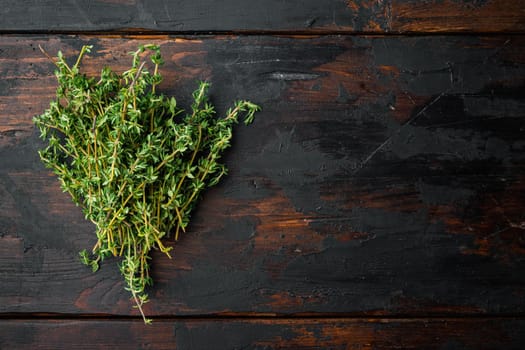 Thyme green fresh bunch, on old wooden table, top view with copy space for text