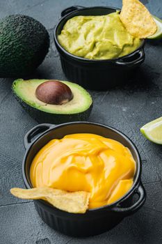 Creamy cheddar sauce with chia seeds in bowl, on gray background