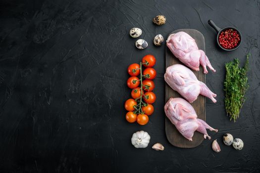 Fresh raw meat quail ready for cooking, flat lay, on black textured background with space for text