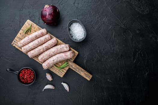 Traditional mest sausages, flat lay with space for text, on black background.