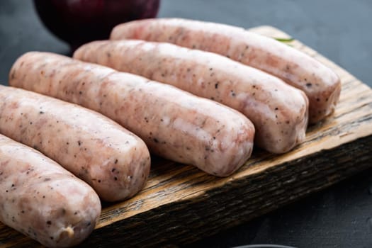 Traditional mest sausages, on black background.