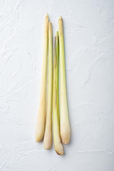 Stick of fresh lemongrass, on white textured background, flat lay