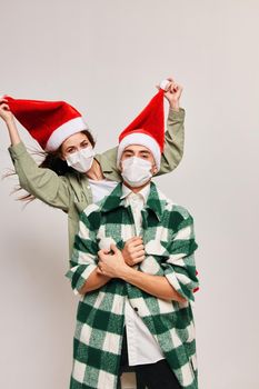 Happy men and women on family holiday Christmas medical mask. High quality photo