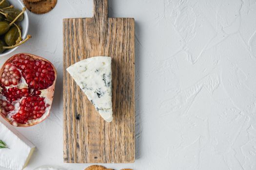 Slice of danish blue cheese, on white background, flat lay with copy space for text