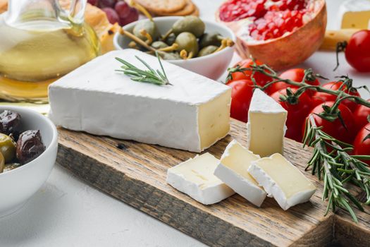Brie type of cheese set, on white background
