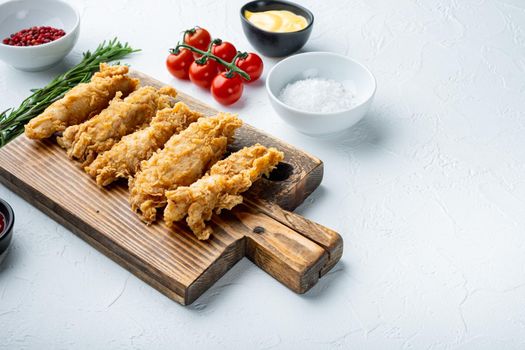 Chicken breaded breast fillet on white background, with space for text.