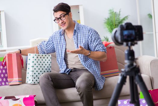 Male fashion blogger recording video for vlog