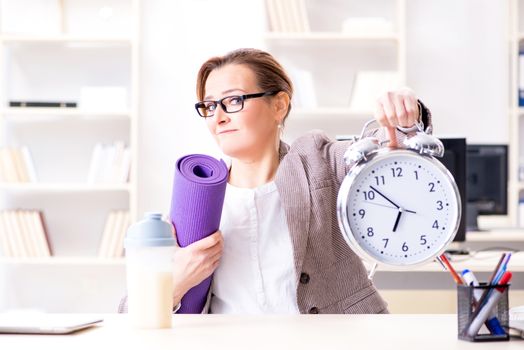 Woman employee going to sports from work during lunch break