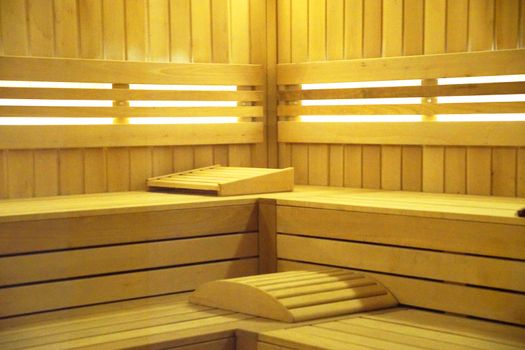 interior of the sauna, finished with wood with lighting.