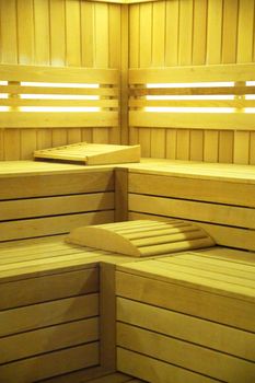 interior of the sauna, finished with wood with lighting.