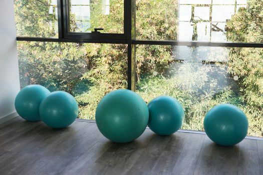 fitness balls by the window in the gym close up