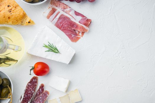 Classic italian antipasti set, on white background, flat lay with copy space for text