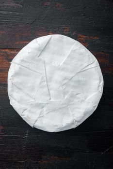 French soft camembert of normandy cheese set, on old wooden table, flat lay