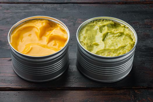 Canned guacamole and cheese dip in can, on old wooden table