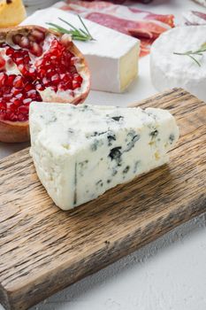 Wedges of soft blue cheese, on white background