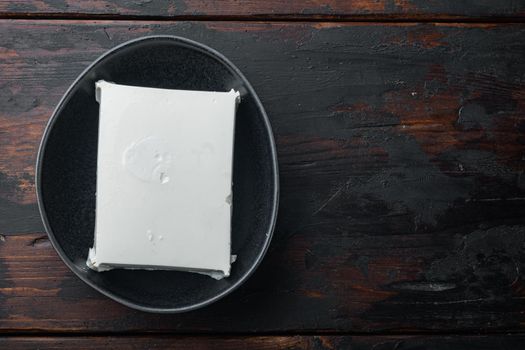 Fresh greek feta cheese set, on old wooden table, flat lay with copy space for text