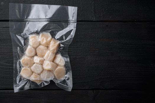 Frozen meat scallops in vacuum package, flat lay with space for text