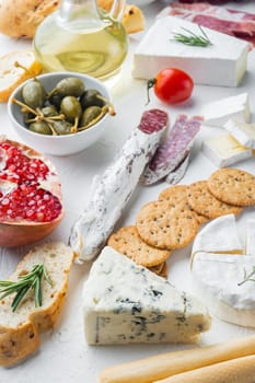 Italian snacks, meat cheese, herbs set, on white background