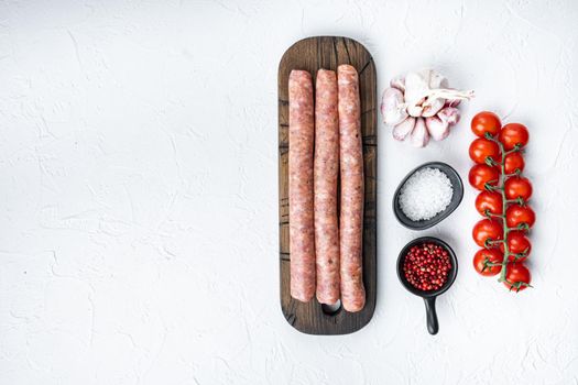 Traditional beef sausages, top view with space for text, on white background.