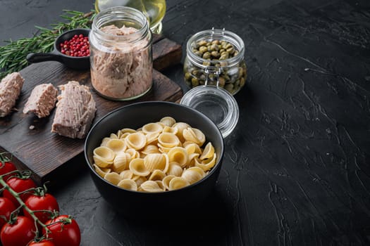 Semolina tuna pasta ingredient, on black background with copy space for text