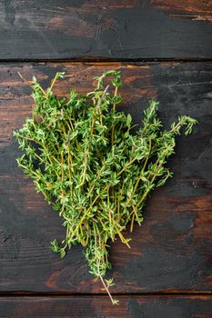 Thyme green fresh bunch, on old wooden table, top view