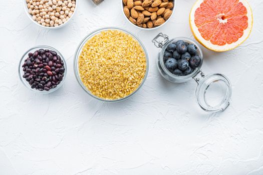 Healthy balanced dieting ingredients concept, flat lay with space for text, on white background.