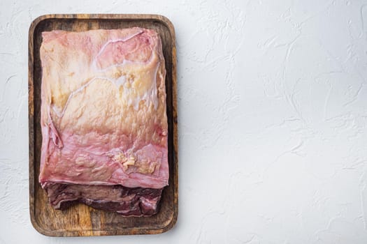 New York steak raw beef meat, on white background, top view, with copy space for text