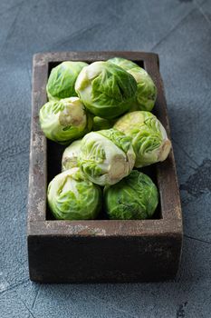Raw brussels sprouts, on grey background