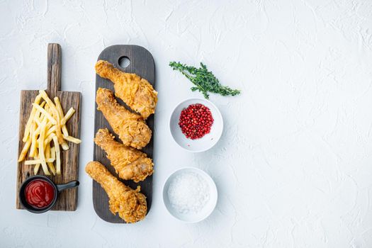 Chicken leg breaded and fried on white background, top view, with space for text.