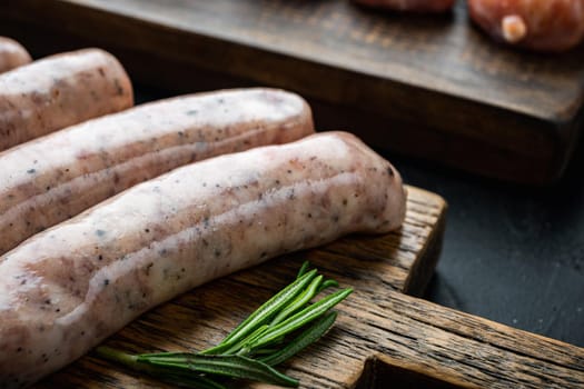 Traditional mest sausages, on black background.