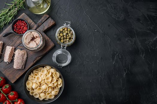Sicilian tuna pasta ingredient, on black background, flat lay with copy space for text