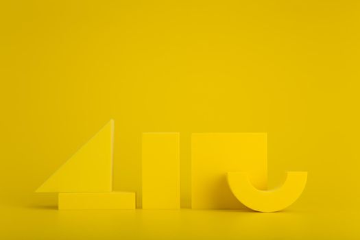 Monochromatic yellow background with geometric figures. Minimal geometric composition. Design for poster or advertising banner with space for text