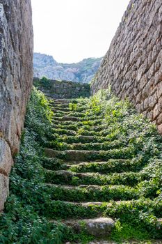 Stoned stairs at Medieval fortress Acrocorinth on a sunny day, Peloponnese, Greece.