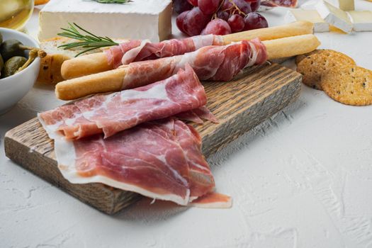 Parma ham set, on white background with copy space for text