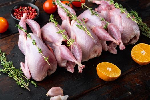 Homemade eco friendly raw quail, on dark wooden background