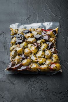 Mediterranean fresh olives, on black background