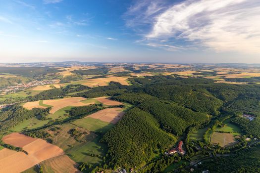 Aerial view at a landscape in Germany, Rhineland Palatinate near Bad Sobernheim with the river Nahe, meadow, farmland, forest, hills, mountains 