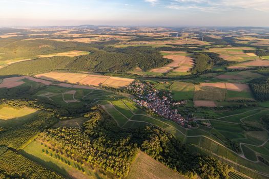 Aerial view at a landscape in Germany, Rhineland Palatinate near Bad Sobernheim with  meadow, farmland, forest, hills, mountains 