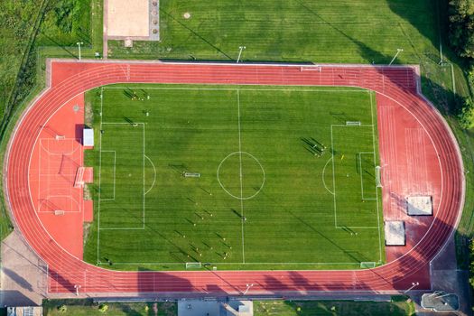 Aerial view at a soccer field with soccer players in Germany, Rhineland Palatinate near Bad Sobernheim 
