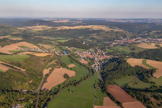 Aerial view at a landscape in Germany, Rhineland Palatinate near Bad Sobernheim with the river Nahe, meadow, farmland, forest, hills, mountains 