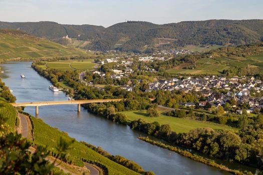 Panoramic view of the Moselle valley with the wine village Mülheim in the background on a sunny autumn day