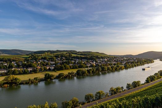 Panoramic view of the Moselle valley with the wine village Brauneberg in the background on a sunny autumn day