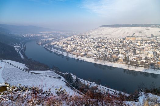 Scenic view of the river Moselle valley and Bernkastel-Kues in winter with snow