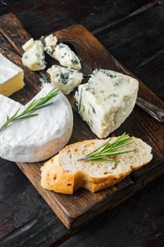 Spanish snacks, meat cheese, herbs set, on dark wooden background