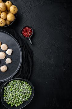 Raw fresh scallops with ingredient, flat lay, on black textured background with space for text