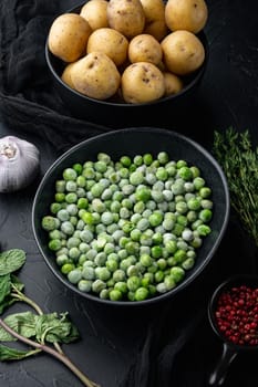 Green peas set, on black textured background